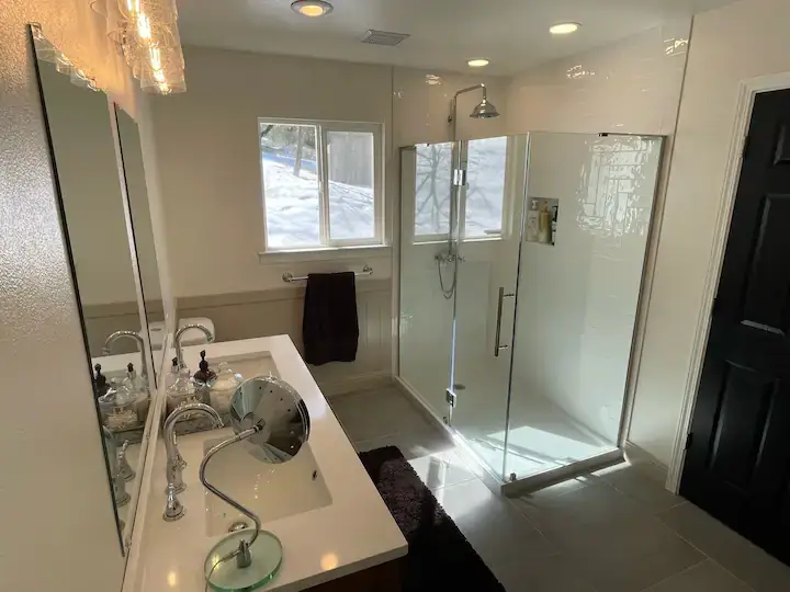 bathroom with walk in shower and vanity
