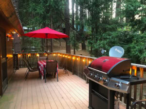 deck with outdoor seating and grill