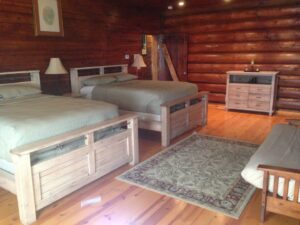 bedroom with two beds and a futon