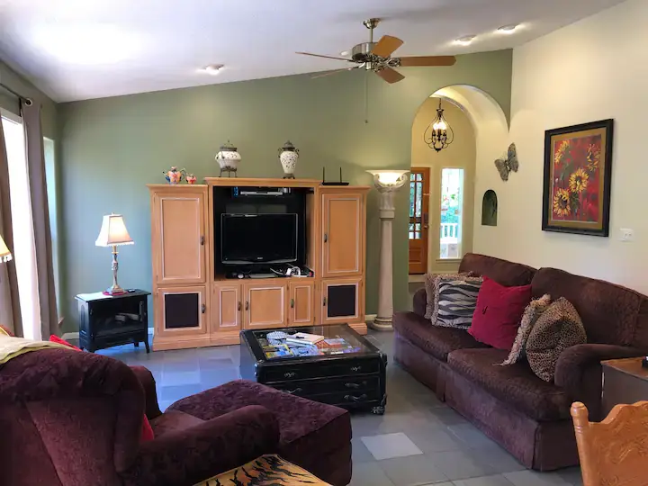 living room with couches and media console