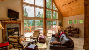 living room with tall ceiling and open windows