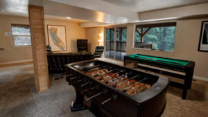 game room with pool table and foosball table