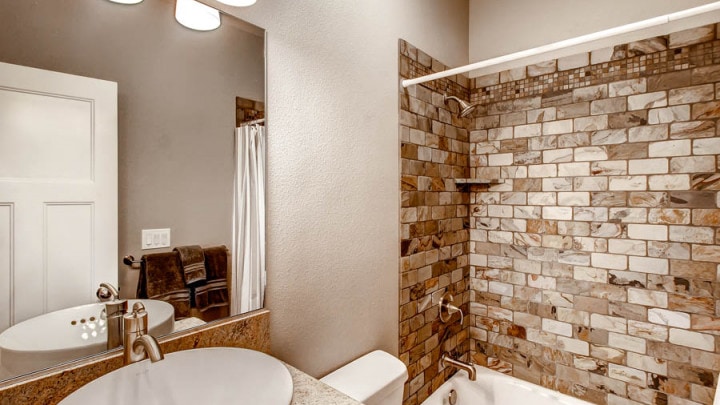 bathroom with shower and tub
