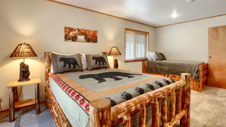 bedroom with hand carved wooden bedframe