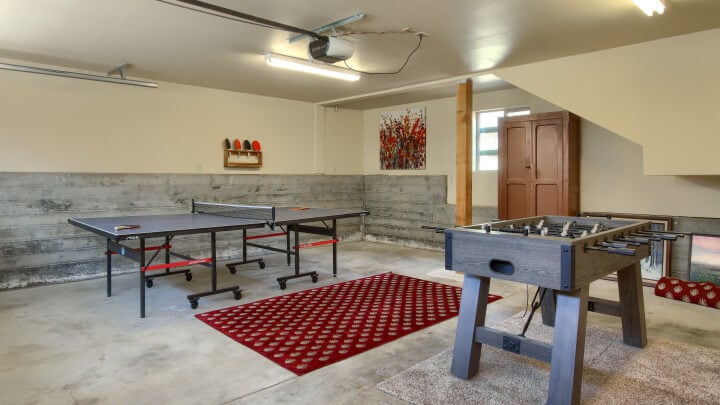 game room with ping pong table and foosball table