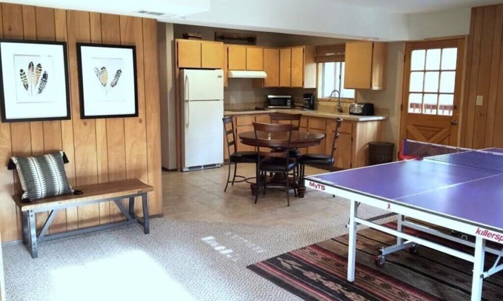 game room with pong pong table and kitchenette