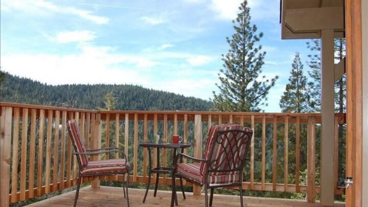 balcony with two chairs and table