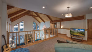 loft with view of living room and television