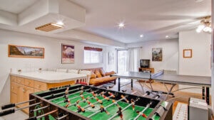 game room with ping pong table and foosball