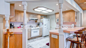 kitchen with bar seating and ceiling light