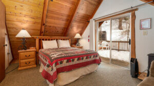 bed under a frame wooden ceiling