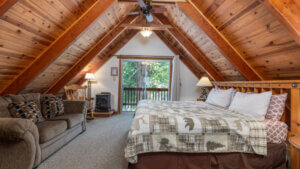 bed under a frame wooden ceiling