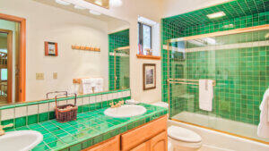 bathroom with green tile accents