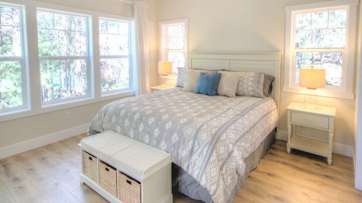 bedroom with large bed ad storage seat