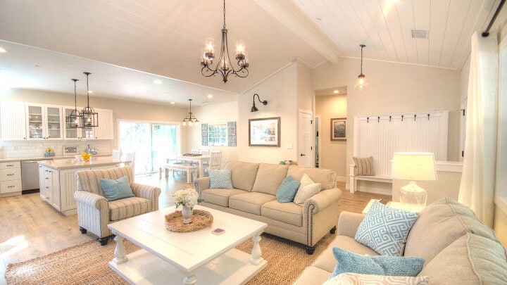 living room with tall ceilings and couches