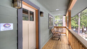 front door and deck with seating