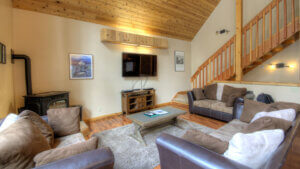 living room with wood stove and television