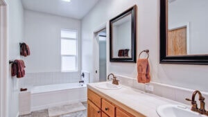 bath room with vanity and tub