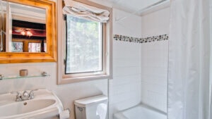 bathroom with bathtub and window