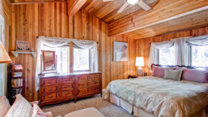 bedroom with queen bed and dresser