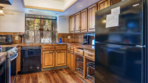 kitchen with wood cabinets and black appliances