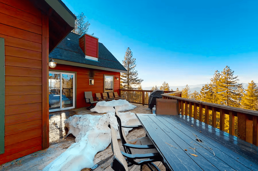 deck with outdoor sining and snow