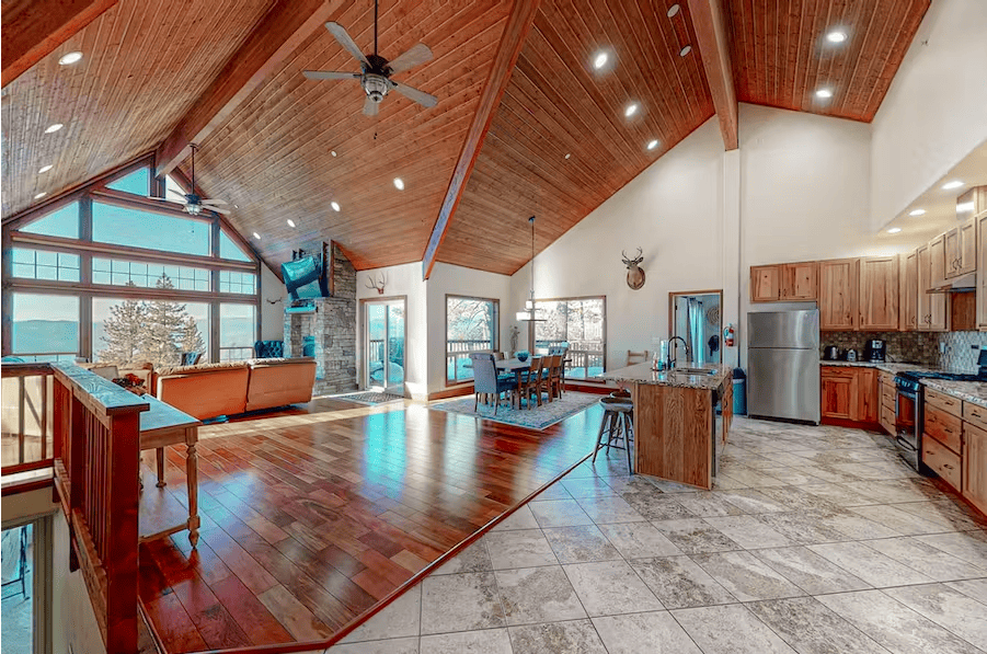 view of living room and kitchen with cathedral ceilings