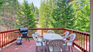 deck with outdoor seating and grill