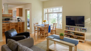 living room with couch and tv and dining room