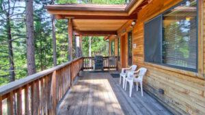 deck with outdoor seating and grill