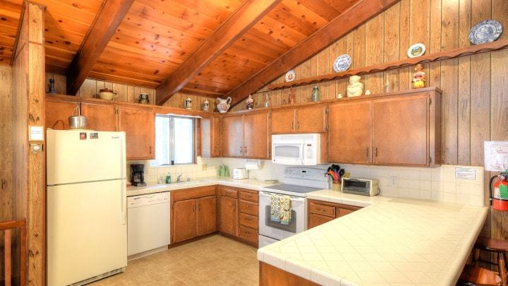 kitchen with wood cabinets and white countertops