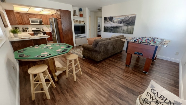 gem room with bar, foosball, and poker table