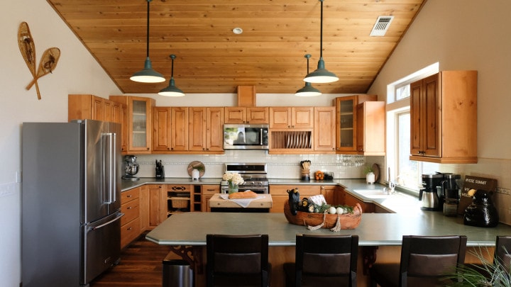 kitchen with wood cabinets and tall ceilings