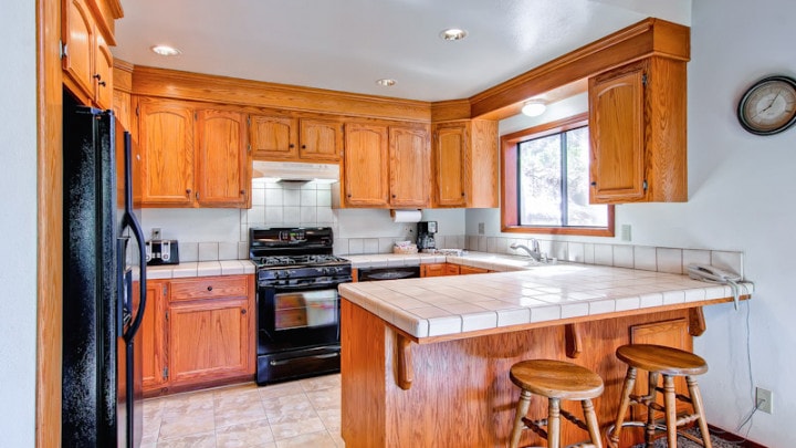 kitchen with wood cabinets and bar seating