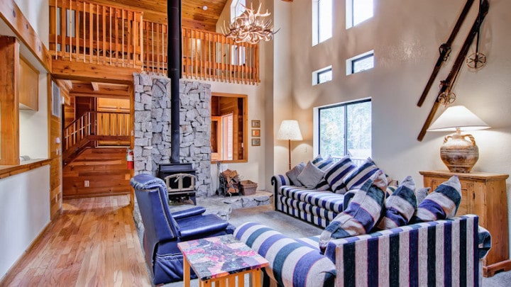 living room with wood stove and couches