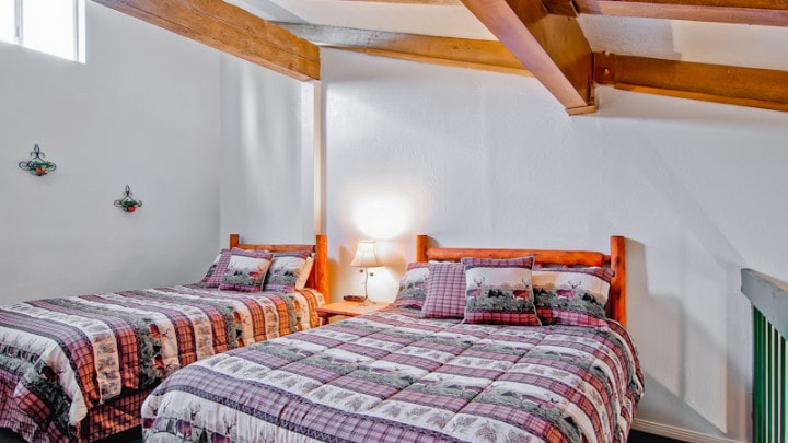 loft bedroom with two beds