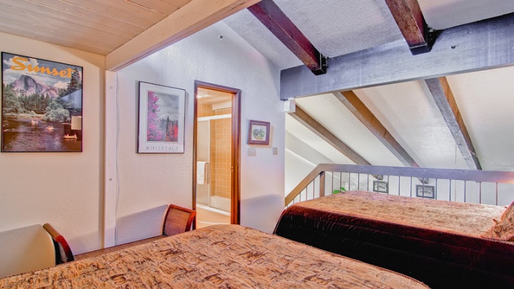 loft bedroom with two beds