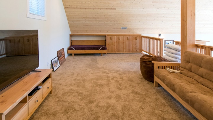 loft with fold out beds, television and seating