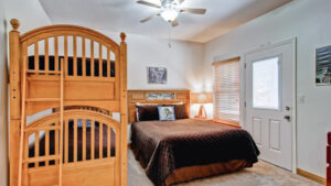 bedroom with full bed and bunk beds