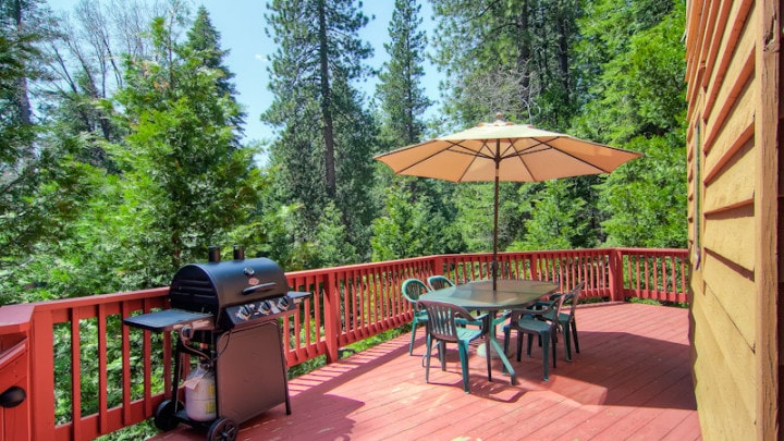 deck with outdoor seating and grill