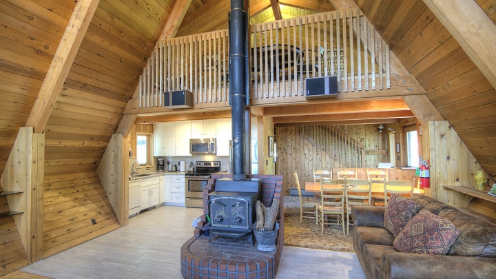 living room with wood stove and couches