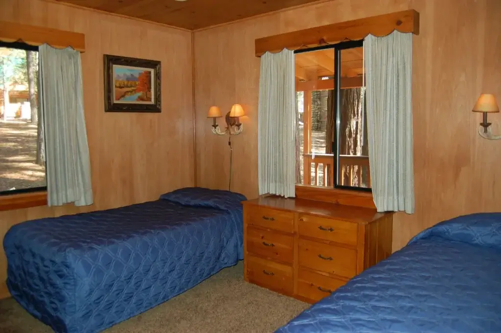 bedroom with twin beds and blue bedding
