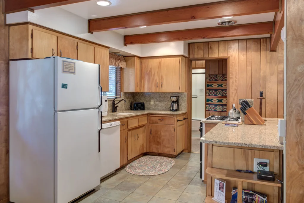 kitchen with wood cabinets and beams