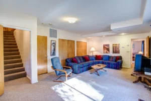 second living area with television and couches