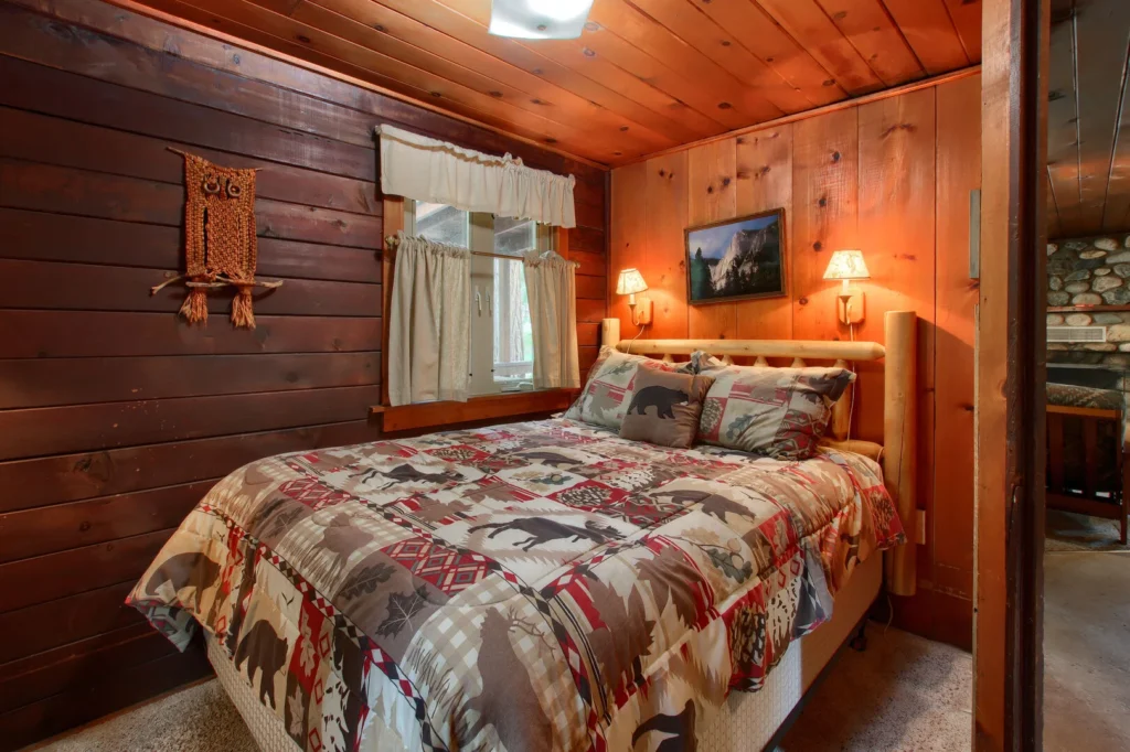 bedroom with wood walls