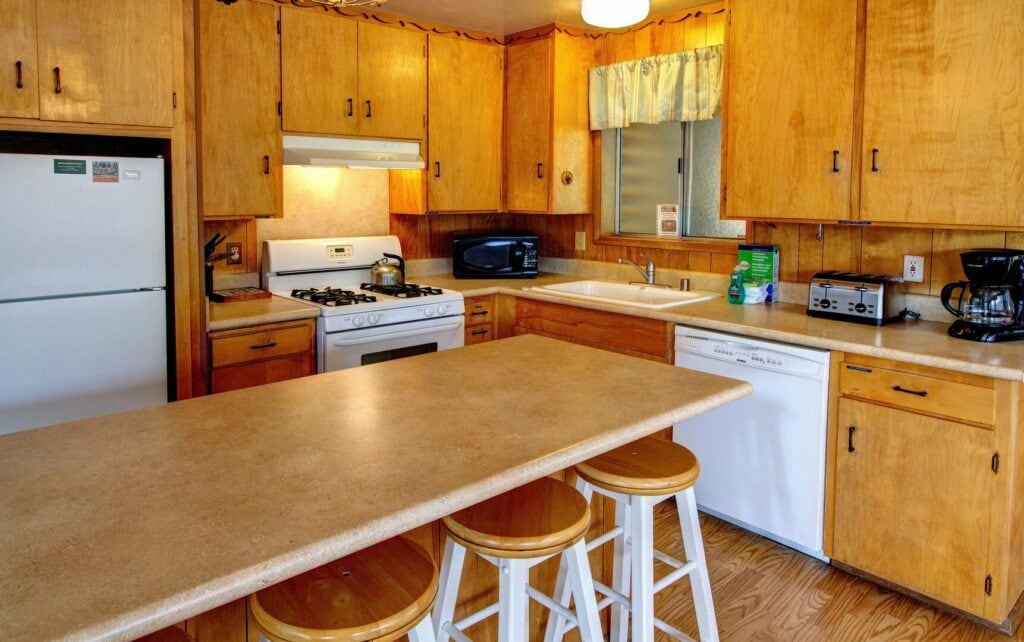 kitchen with wood cabinets and white appliances