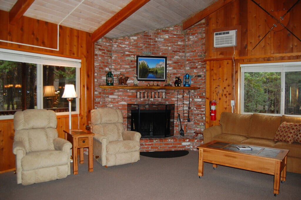 living room with brick fireplace