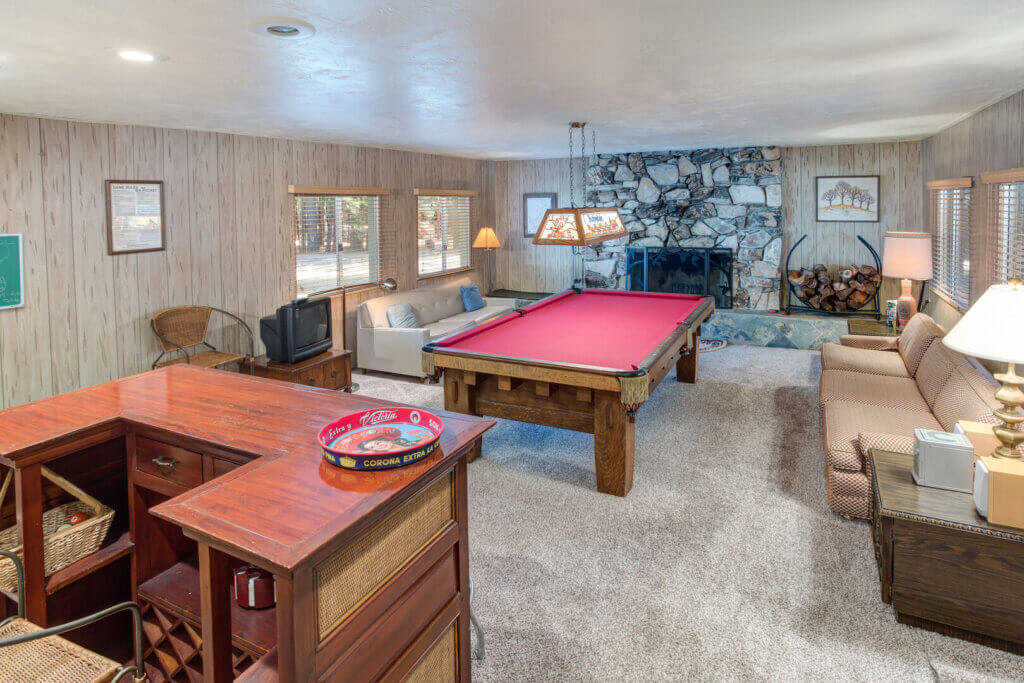 game room with bar and pool table