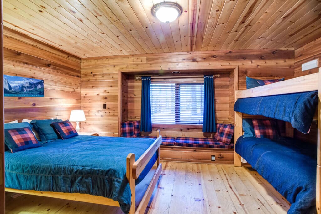 bedroom with queen bed and bunkbeds