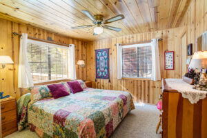 bedroom with cedar planked walls